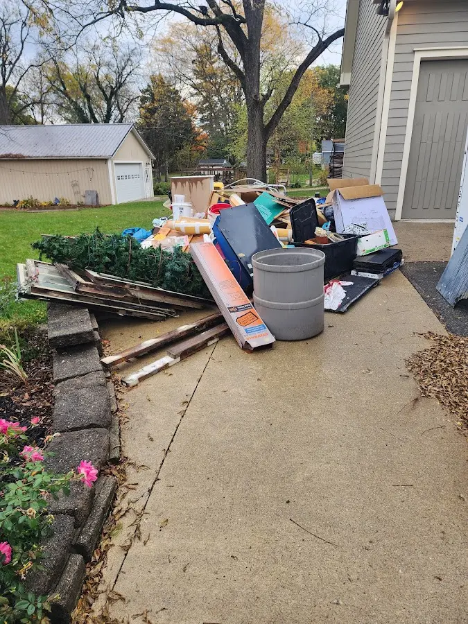 Dumpster being loaded with debris for Roofing Dumpster Rental in Mamaroneck
